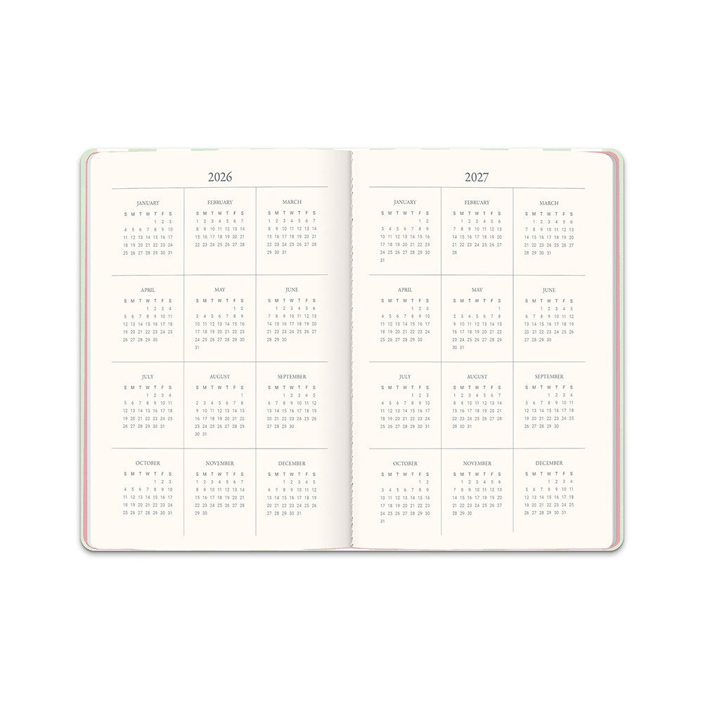 Orange Circle 2027 Casebound Diary 143 x 205mm Month To View Cabana Stripes shown from a second angle, the Cabana Stripes design, a crisp vertical stripe in soft coastal tones, with the spine and page block edge visible.