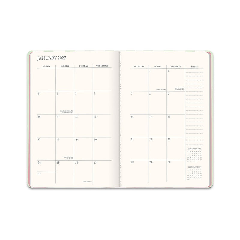 Orange Circle 2027 Casebound Diary 143 x 205mm Month To View Cabana Stripes opened to show the printed month to view interior pages and the dated planning grid.