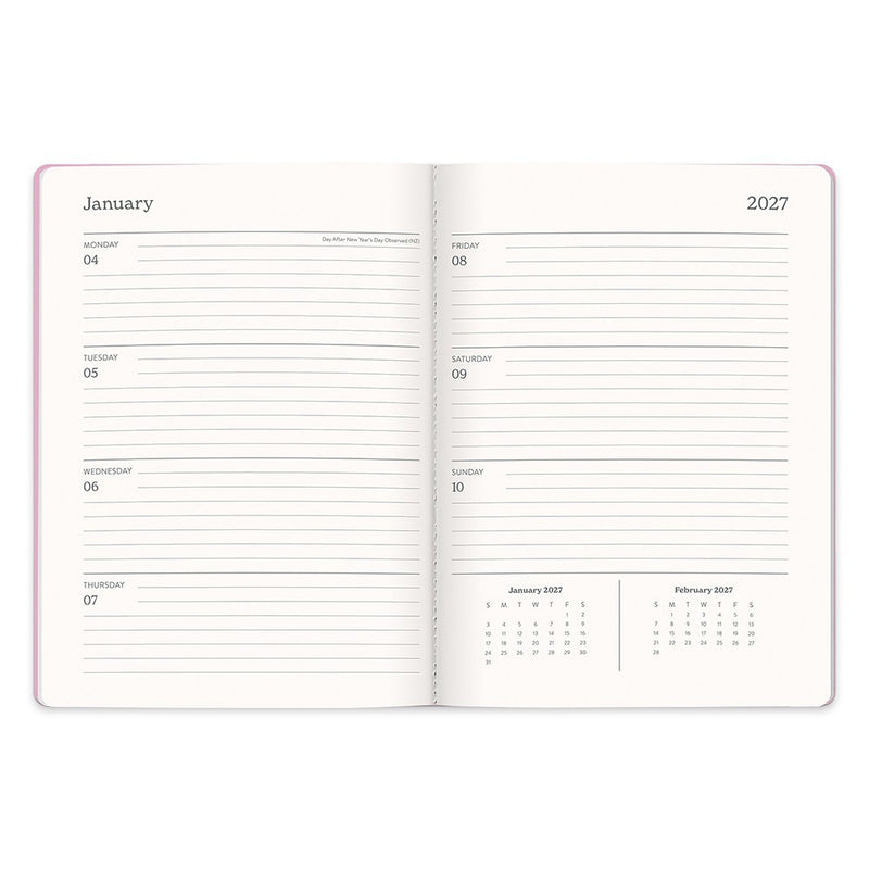 Orange Circle 2027 Casey Diary 178 x 240mm Week To View Cabana Stripes shown at a three quarter angle, the Cabana Stripes design, a crisp vertical stripe in soft coastal tones, highlighting the cover finish and binding edge.