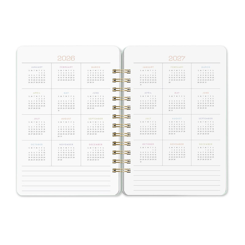 Orange Circle 2027 Do-It-All Diary 146 x 210mm Week To View Fruit And Flora shown from a second angle, the Fruit And Flora design, a bright botanical mix of fruit and flowers, with the spine and page block edge visible.