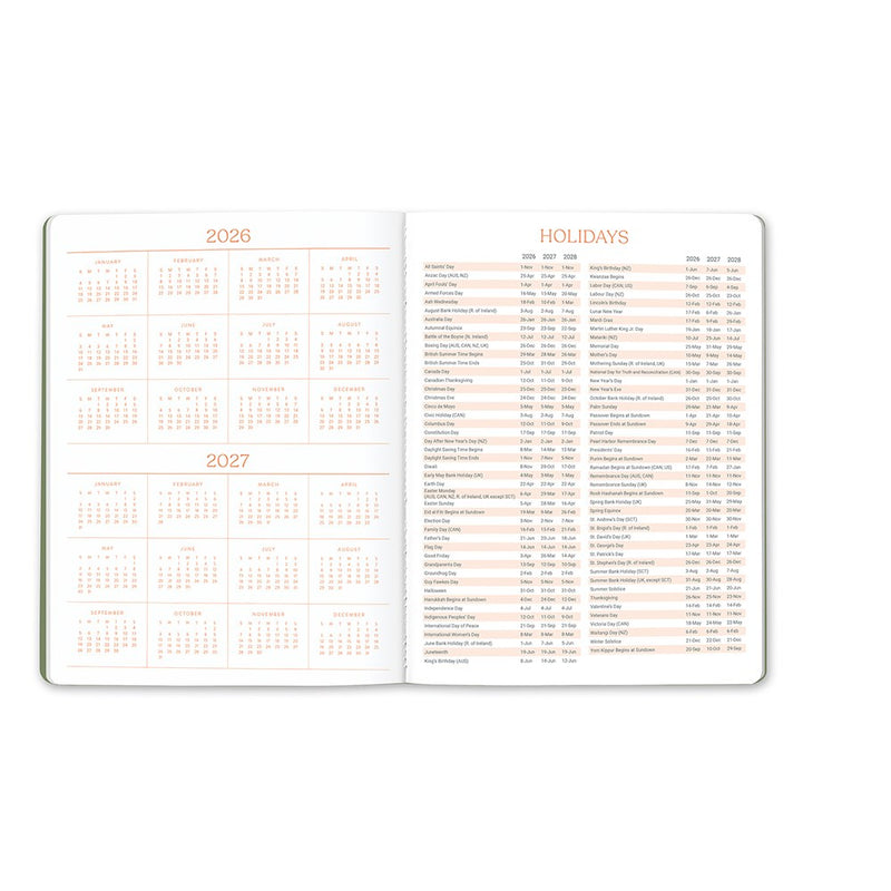 Orange Circle 2027 Just Right Diary 191 x 248mm Month To View Fruit And Flora shown at a three quarter angle, the Fruit And Flora design, a bright botanical mix of fruit and flowers, highlighting the cover finish and binding edge.