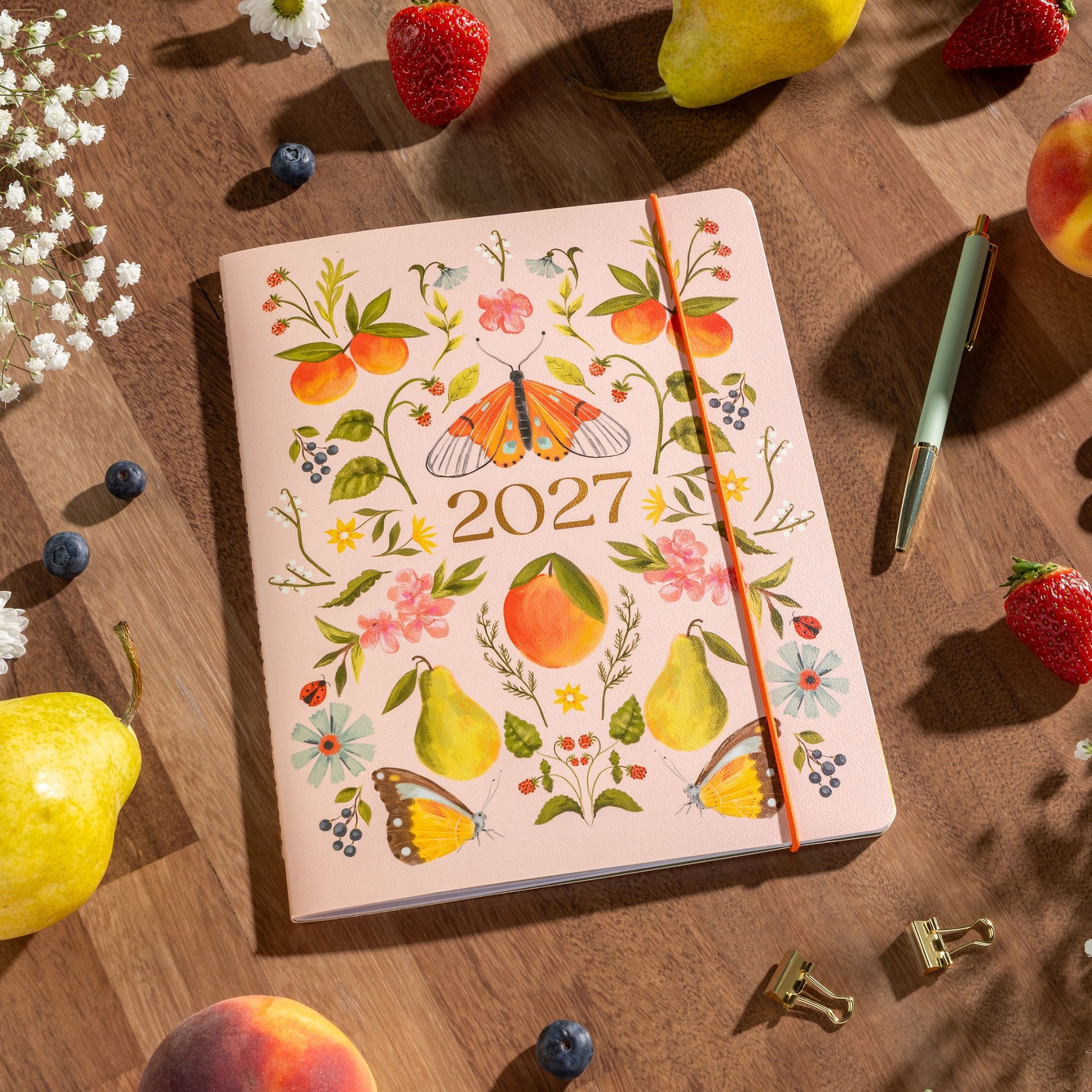 Orange Circle 2027 Just Right Diary 191 x 248mm Month To View Fruit And Flora shown in a further cover view, the Fruit And Flora design, a bright botanical mix of fruit and flowers, with the full front face in frame.