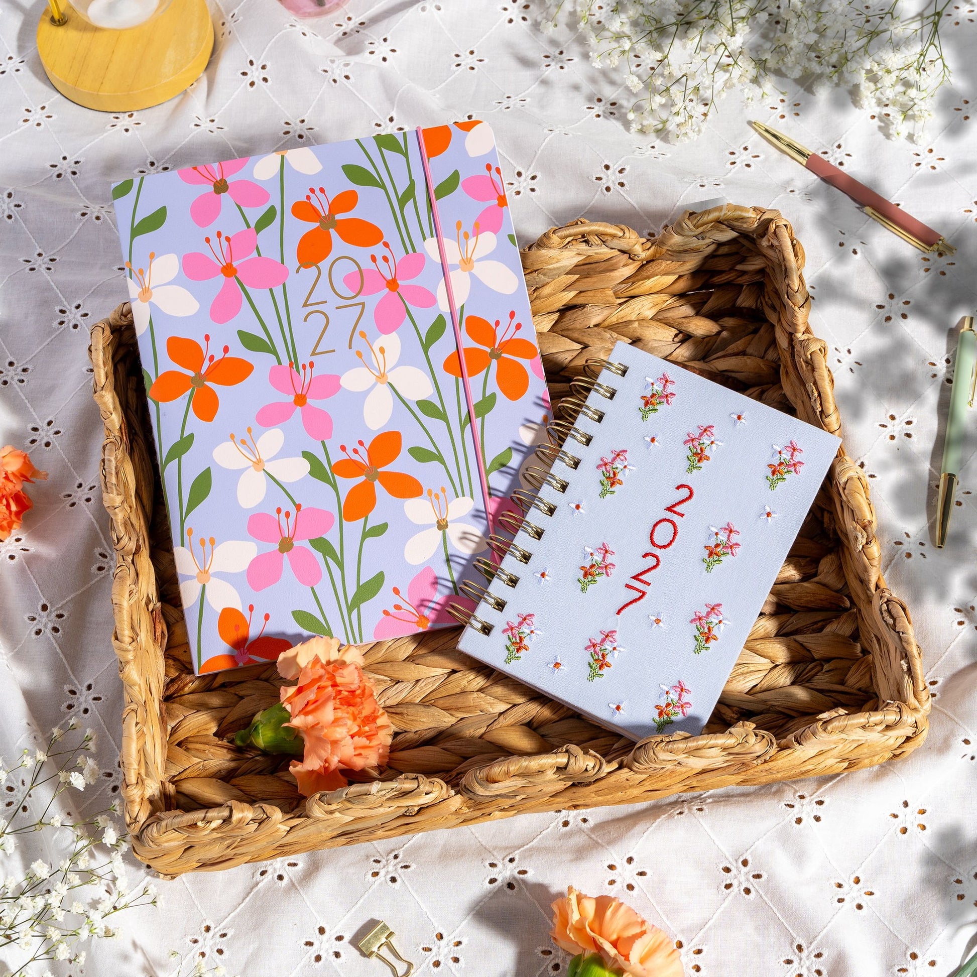 Orange Circle 2027 Just Right Diary 191 x 248mm Month To View Secret Garden shown from a further angle, the Secret Garden design, a dense garden print in layered greens and blooms, showing the cover corners and closure detail.