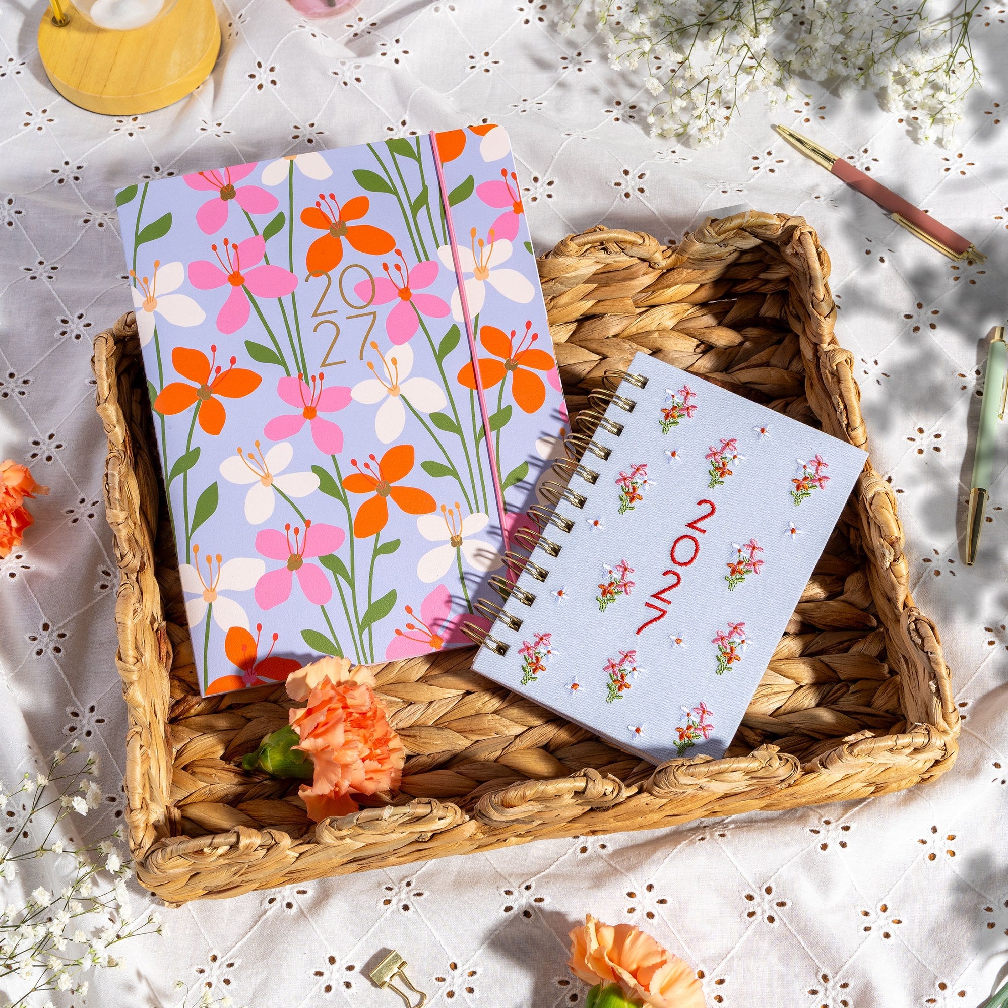 Orange Circle 2027 Just Right Diary 191 x 248mm Month To View Secret Garden shown from a further angle, the Secret Garden design, a dense garden print in layered greens and blooms, showing the cover corners and closure detail.