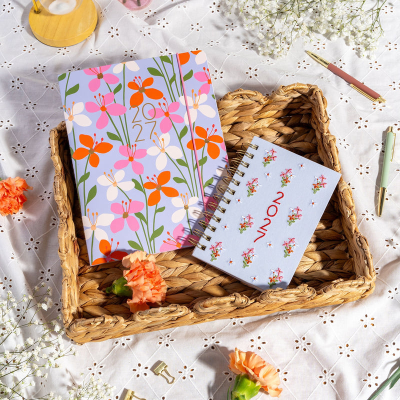 Orange Circle 2027 Just Right Diary 191 x 248mm Month To View Secret Garden shown in an additional cover view, the Secret Garden design, a dense garden print in layered greens and blooms, against a plain background.