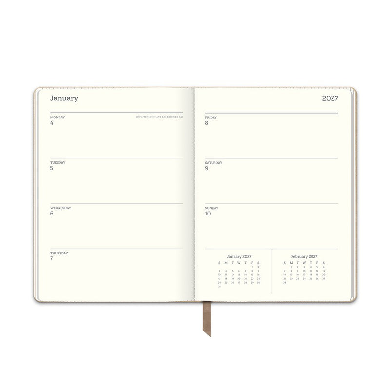Orange Circle 2027 Medium Dual-Textured Diary 142 x 193mm Week To View Dots On Chai shown from a second angle, the Dots On Chai design, a fine dot on a warm chai neutral, with the spine and page block edge visible.