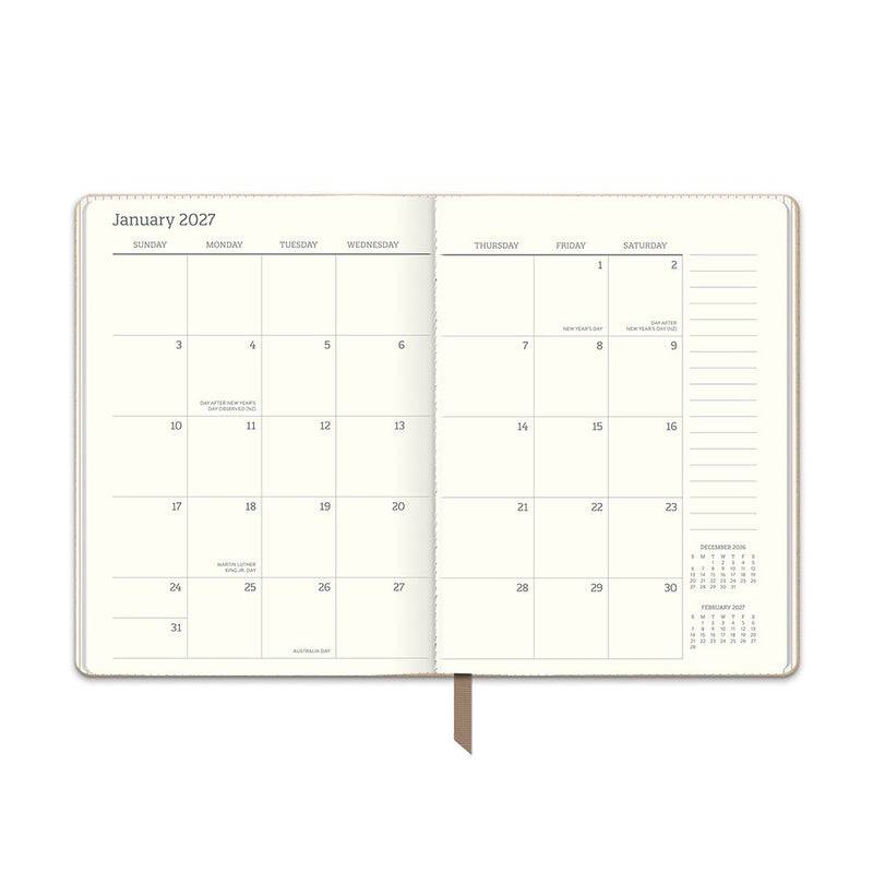 Orange Circle 2027 Medium Dual-Textured Diary 142 x 193mm Week To View Dots On Chai opened to show the printed week to view interior pages and the dated planning grid.