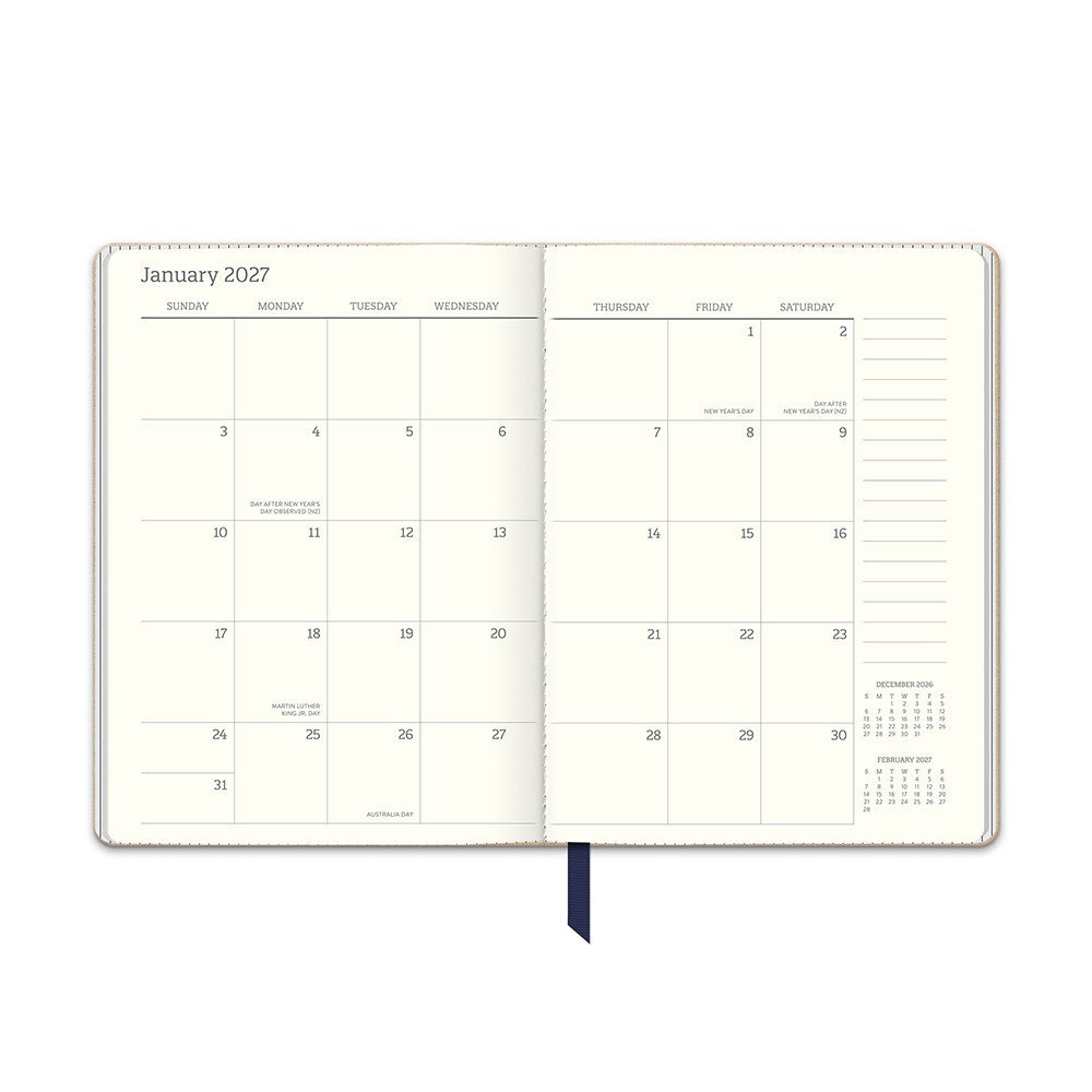 Orange Circle 2027 Medium Dual-Textured Diary 142 x 193mm Week To View Dots On Navy opened to show the printed week to view interior pages and the dated planning grid.