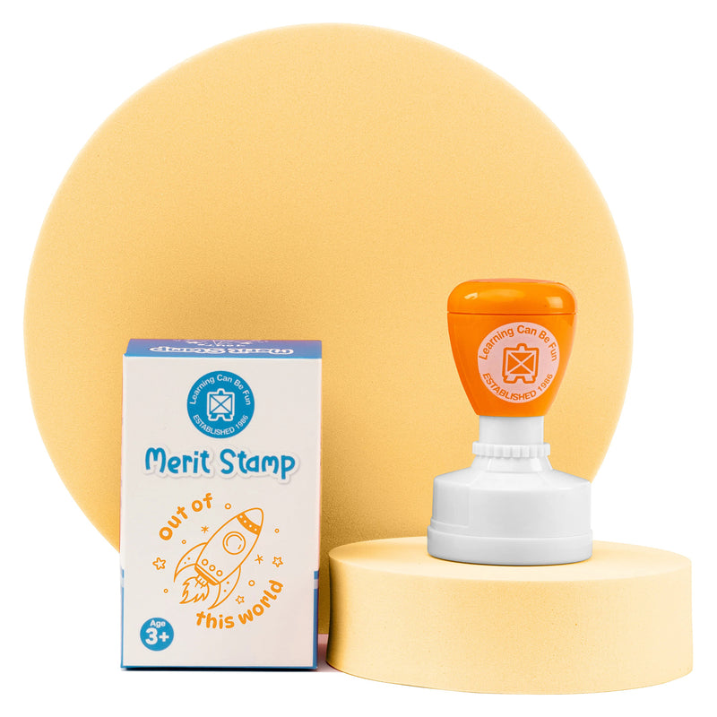 Retail packaging and merit stamp presented together on a display stand. The space inspired reward theme showcases a fun and engaging classroom tool designed to motivate and celebrate student accomplishments.