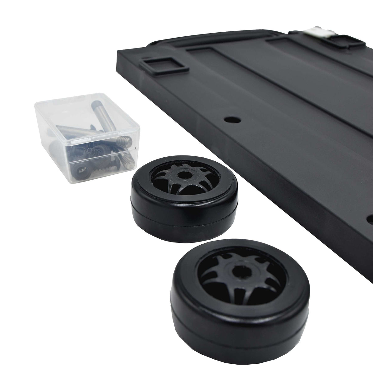 Two black wheels and the box of screws from the Panaro MAX520 trolley kit beside the panel corner
