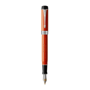 Parker Duofold Classic fountain pen in Big Red resin standing upright, uncapped, palladium trims and two-tone gold nib