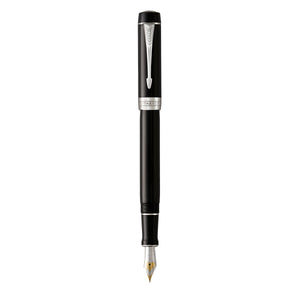Parker Duofold Classic fountain pen in black resin with palladium trims standing upright with its cap posted off