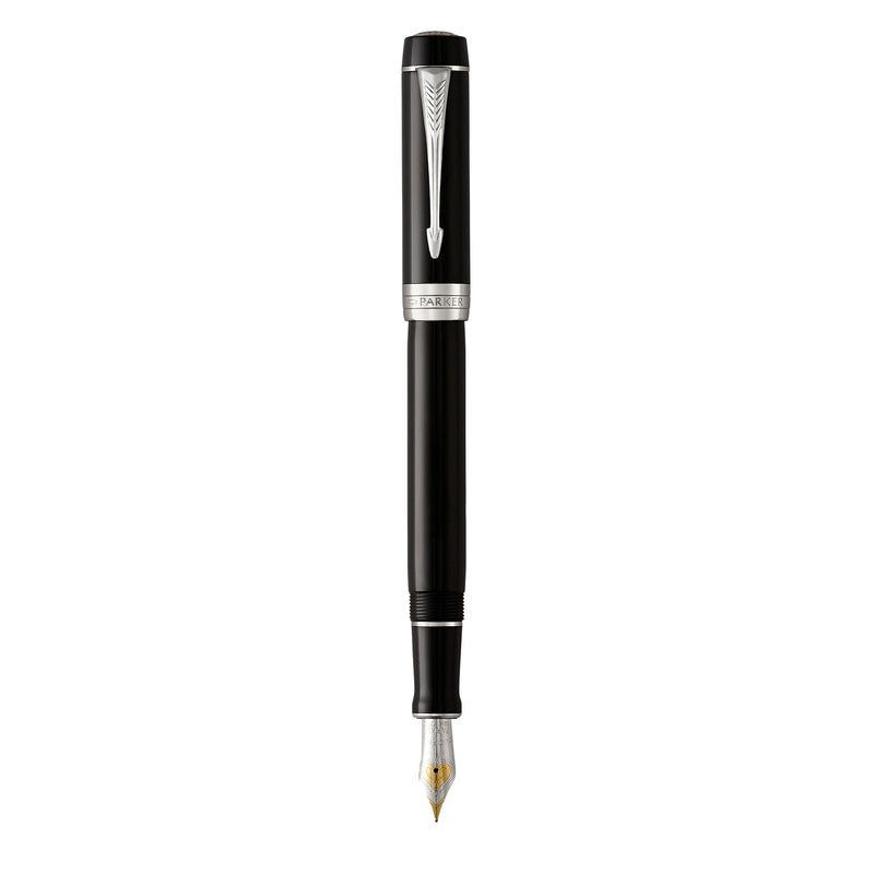 Parker Duofold Classic fountain pen in black resin with palladium trims standing upright with its cap posted off