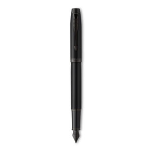 Parker IM Achromatic fountain pen standing upright and uncapped in matte black with a dark steel nib