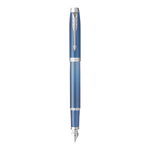 Parker IM Writing Rituals fountain pen in blue lacquer with chrome trims, standing upright with the cap posted