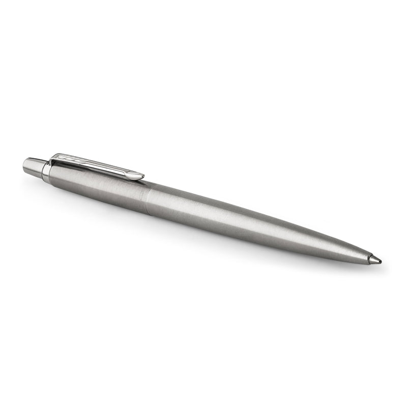 Stainless steel Jotter ballpoint lying at an angle with the clip and click button on the left
