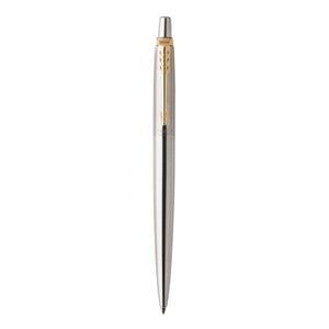 Parker Jotter ballpoint in brushed stainless steel with gold-tone clip, cone and top button, standing upright on white