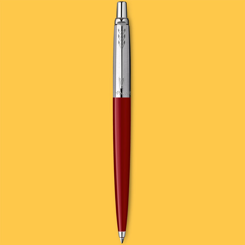 Red Jotter Original ballpoint standing upright on a yellow background