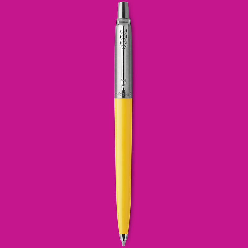 Yellow Jotter Original ballpoint standing upright on a magenta background