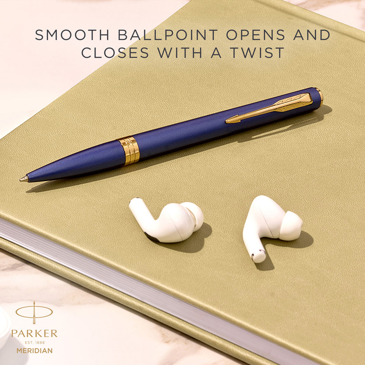 Blue Meridian ballpoint resting on a desk, with Parker's caption that the smooth ballpoint opens and closes with a twist