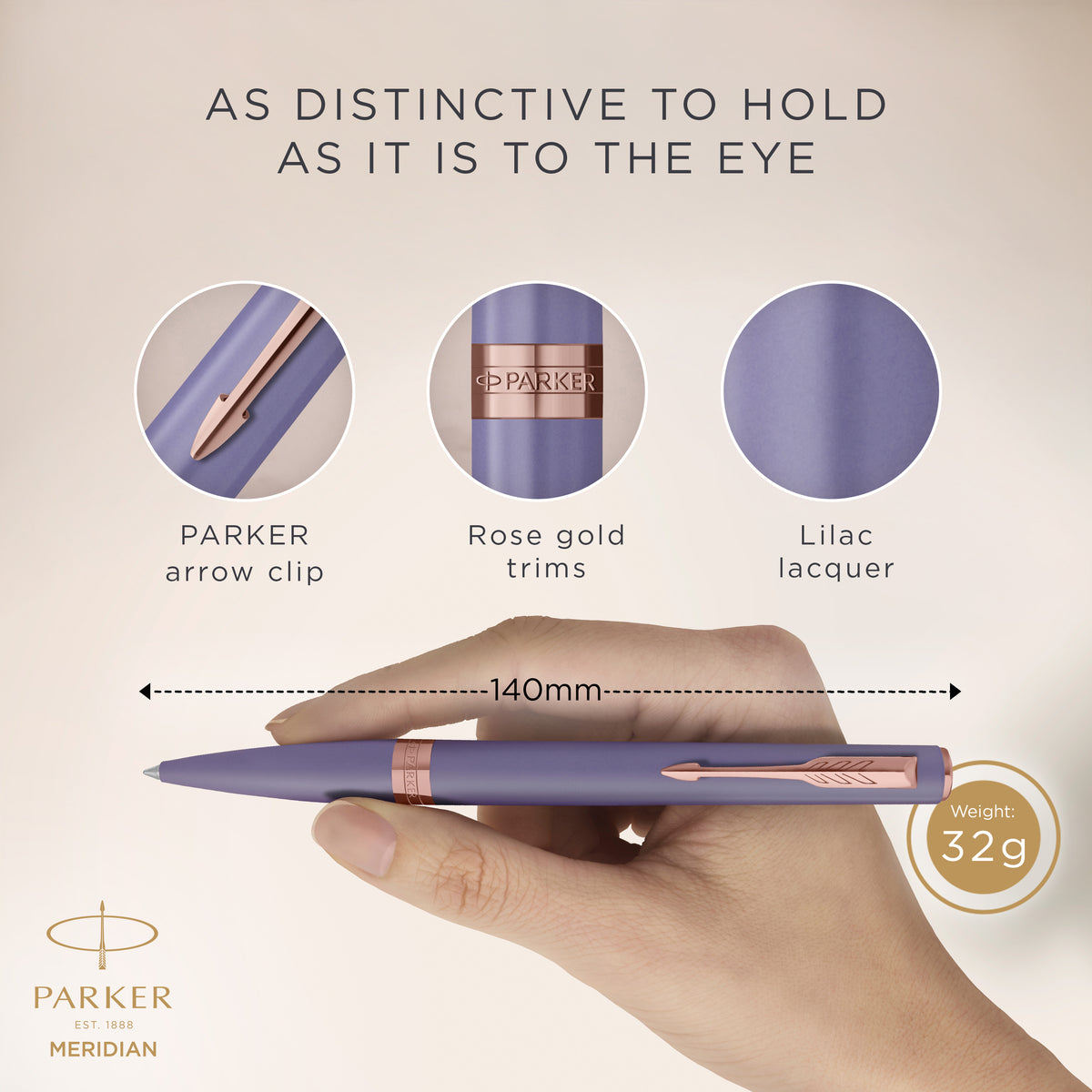 Hand holding the lilac Meridian ballpoint with close-ups of the PARKER arrow clip, pink gold trims and lilac lacquer, marked 140 mm long and 32 g