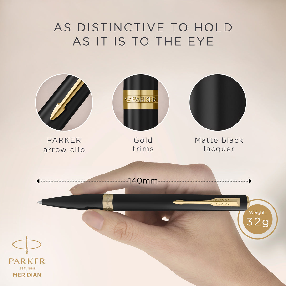 Hand holding the matte black Meridian ballpoint with close-ups of the PARKER arrow clip, gold trims and matte black lacquer, marked 140 mm long and 32 g