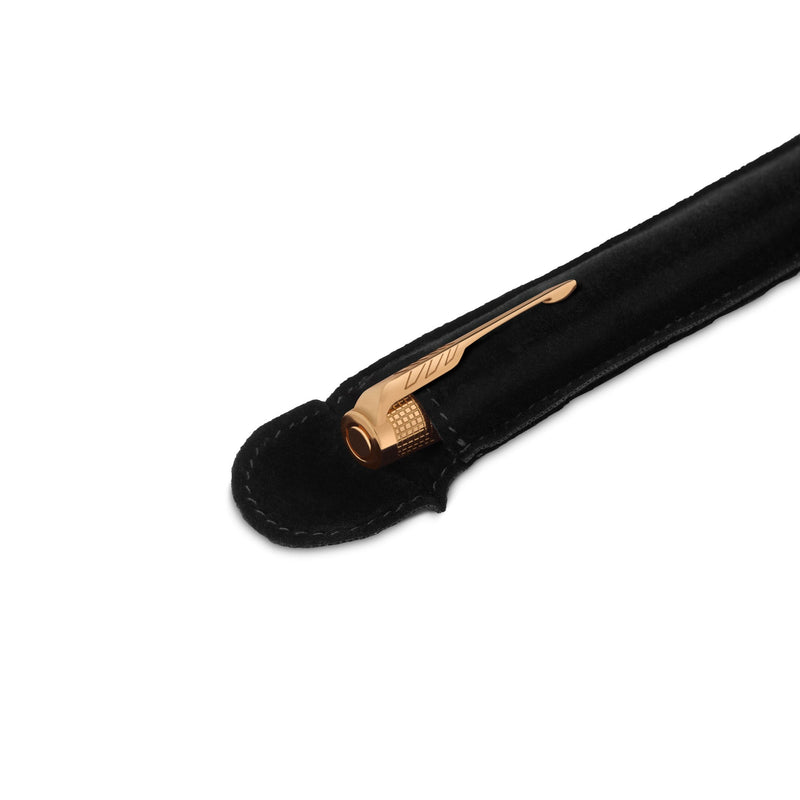 Gold arrow clip of the Ciselé fountain pen peeking out of its black fabric protective pouch