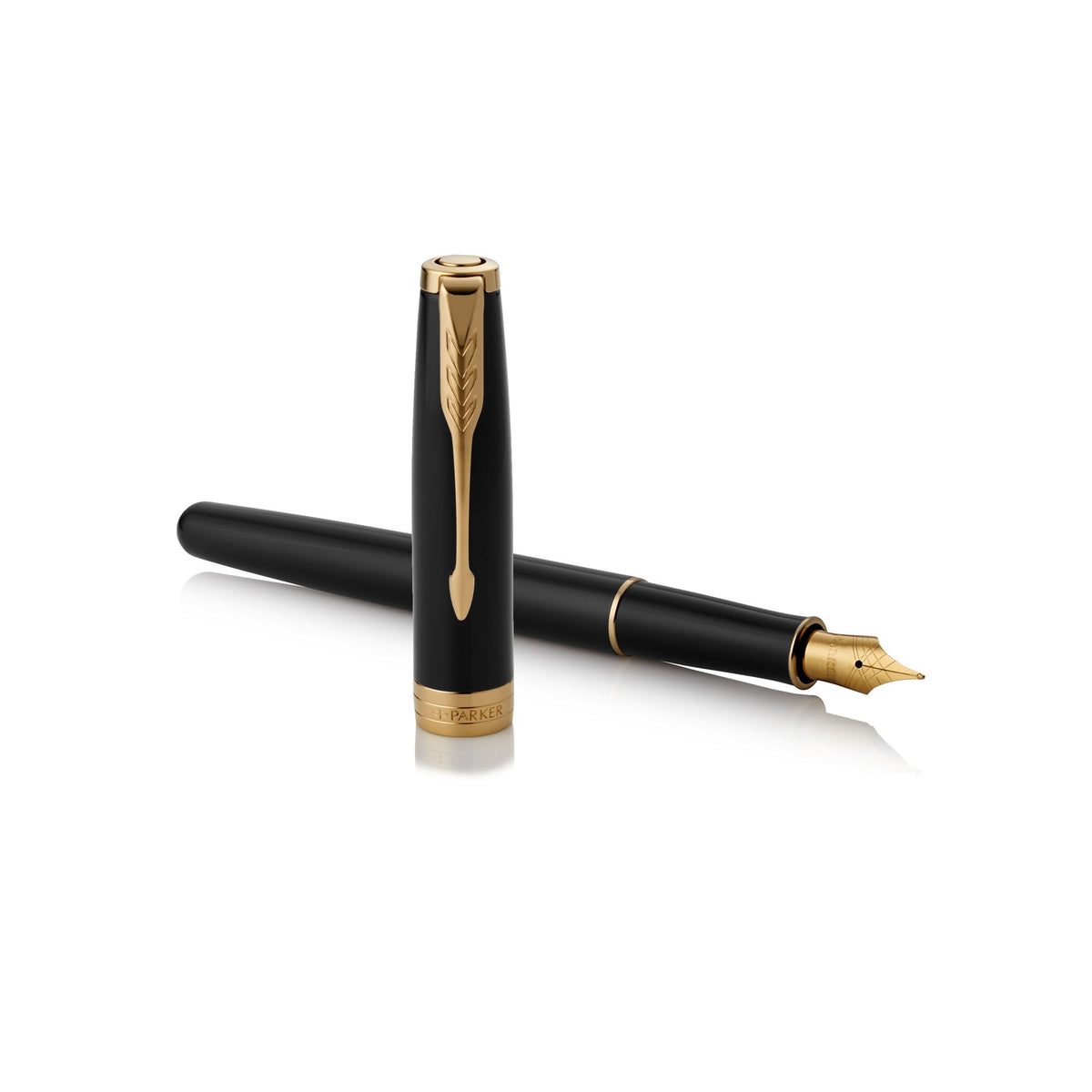 Uncapped black and gold Sonnet lying across its upright cap with the nib pointing right