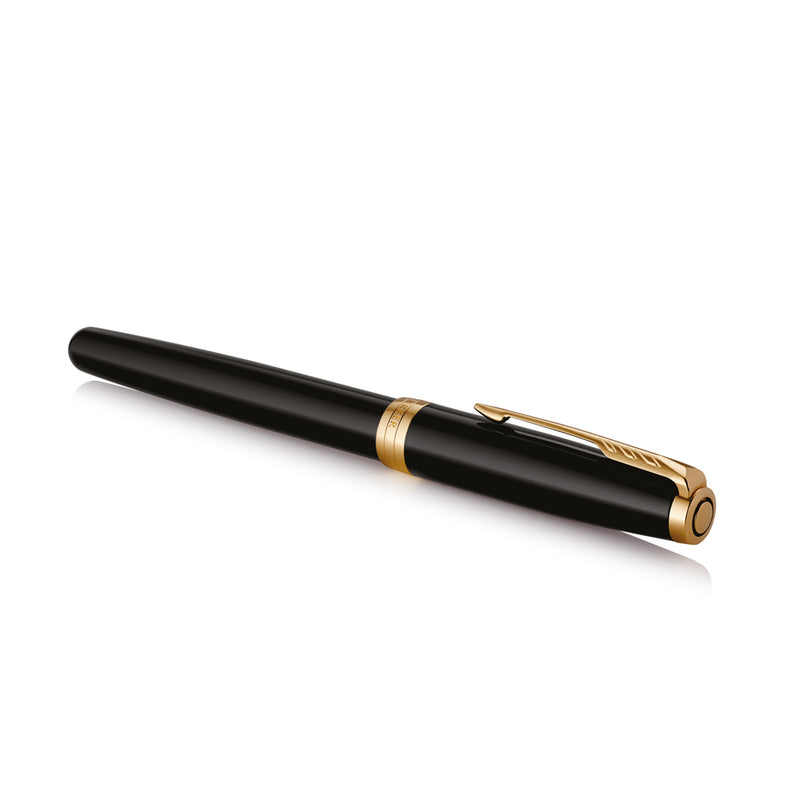 Capped black lacquer Sonnet fountain pen lying at an angle, clip facing the camera
