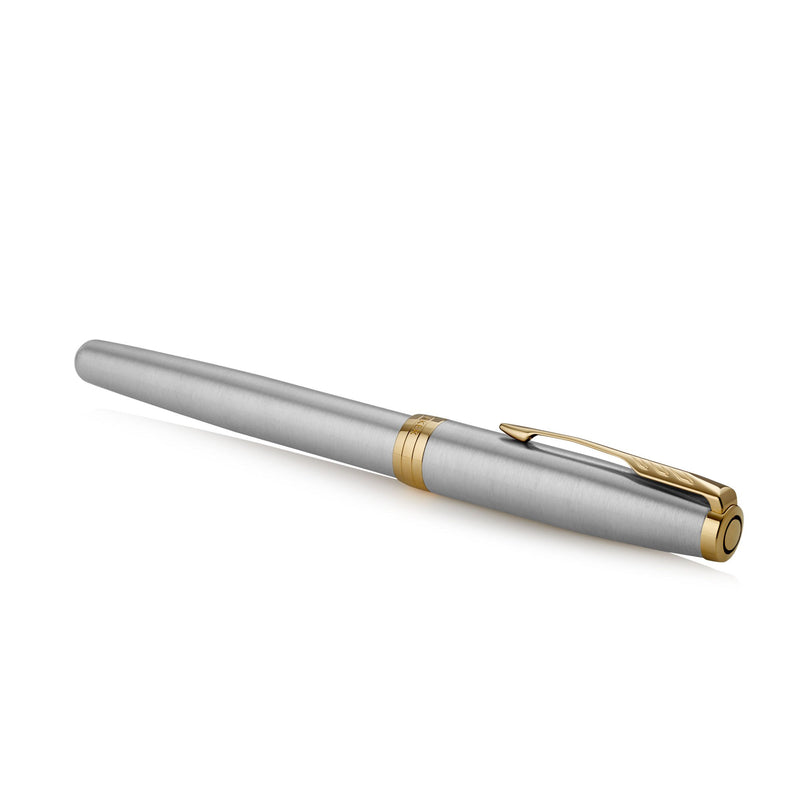 Capped stainless steel Sonnet lying at an angle, showing the gold clip from above
