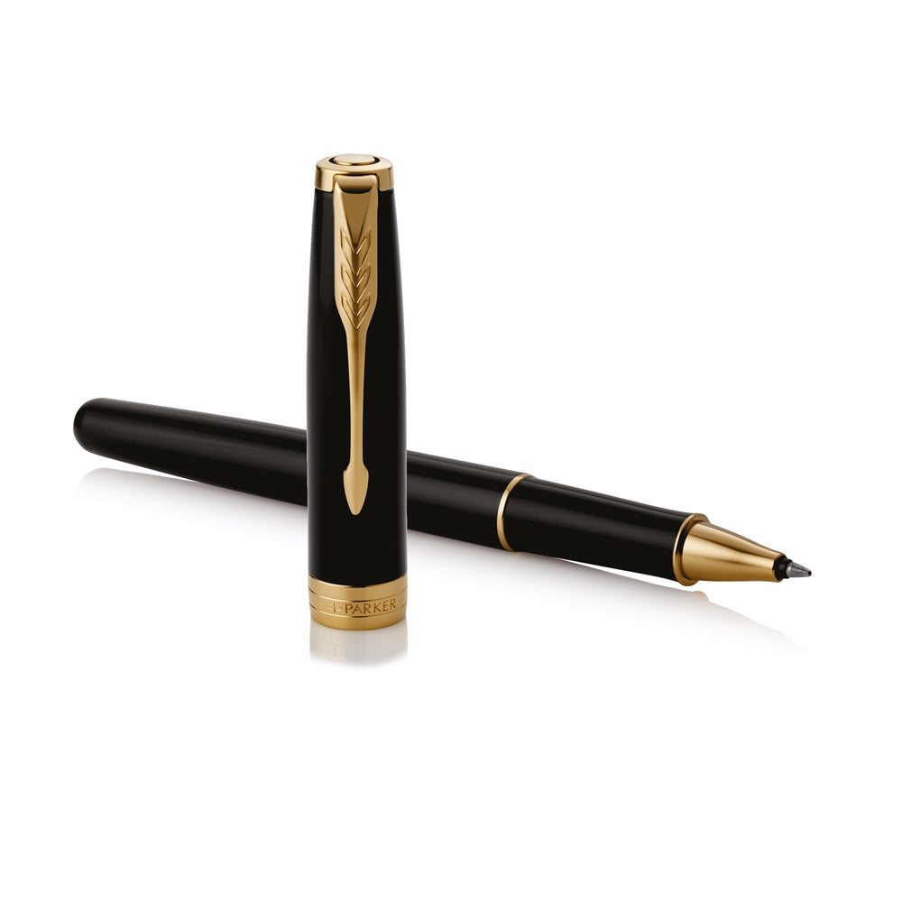 Uncapped black Sonnet rollerball lying across its upright cap, fine tip to the right