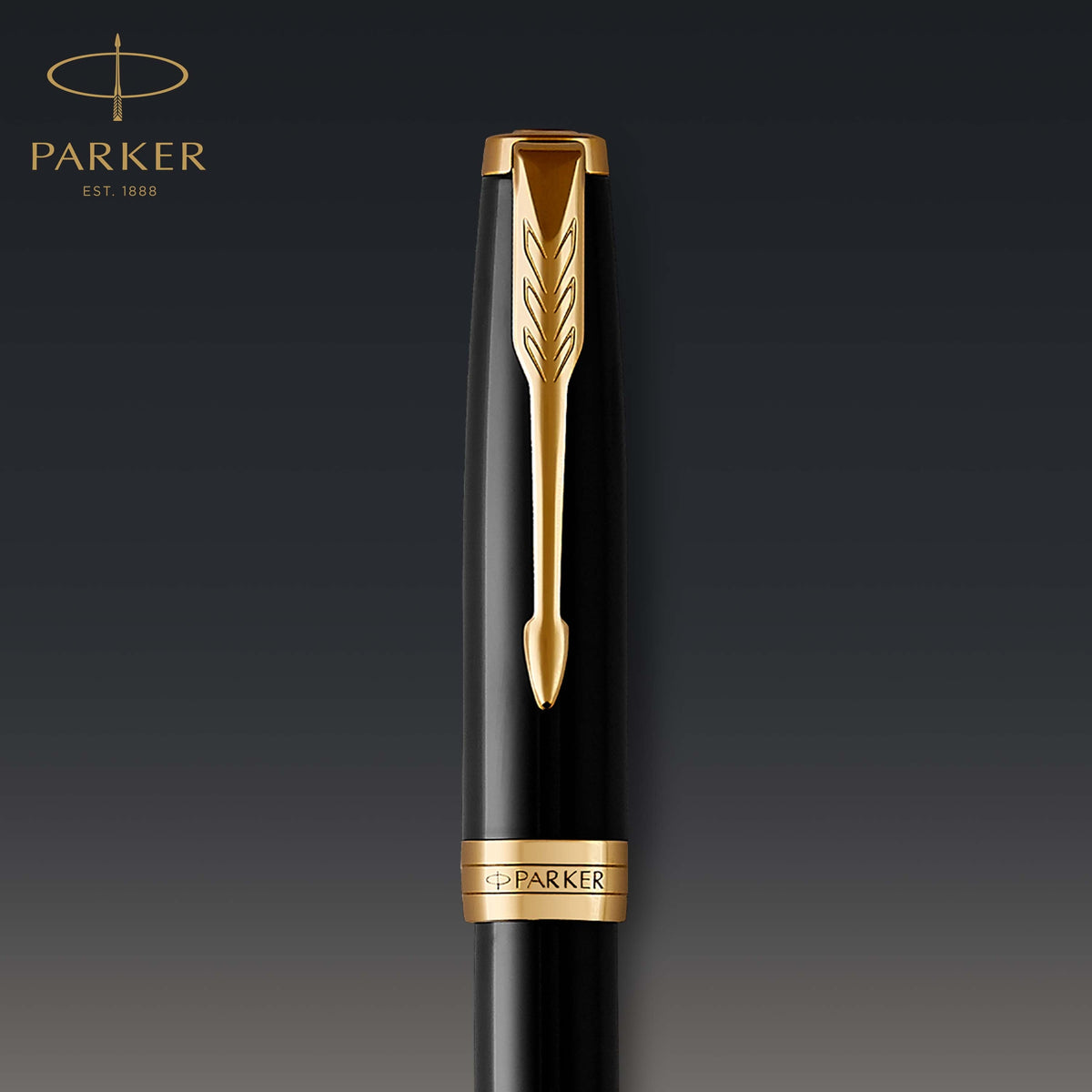 Close-up of the black lacquer cap with gold clip and engraved band