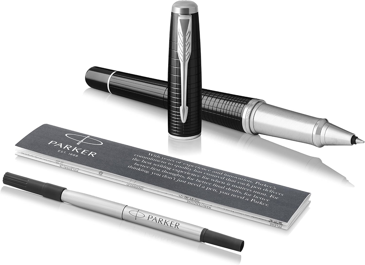 Parker Urban Premium rollerball pen laid beside a spare Parker rollerball refill and the printed Parker information card, showing what is supplied in the box.