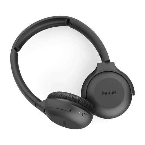 Philips wireless headphones shown on a desk in an office setting