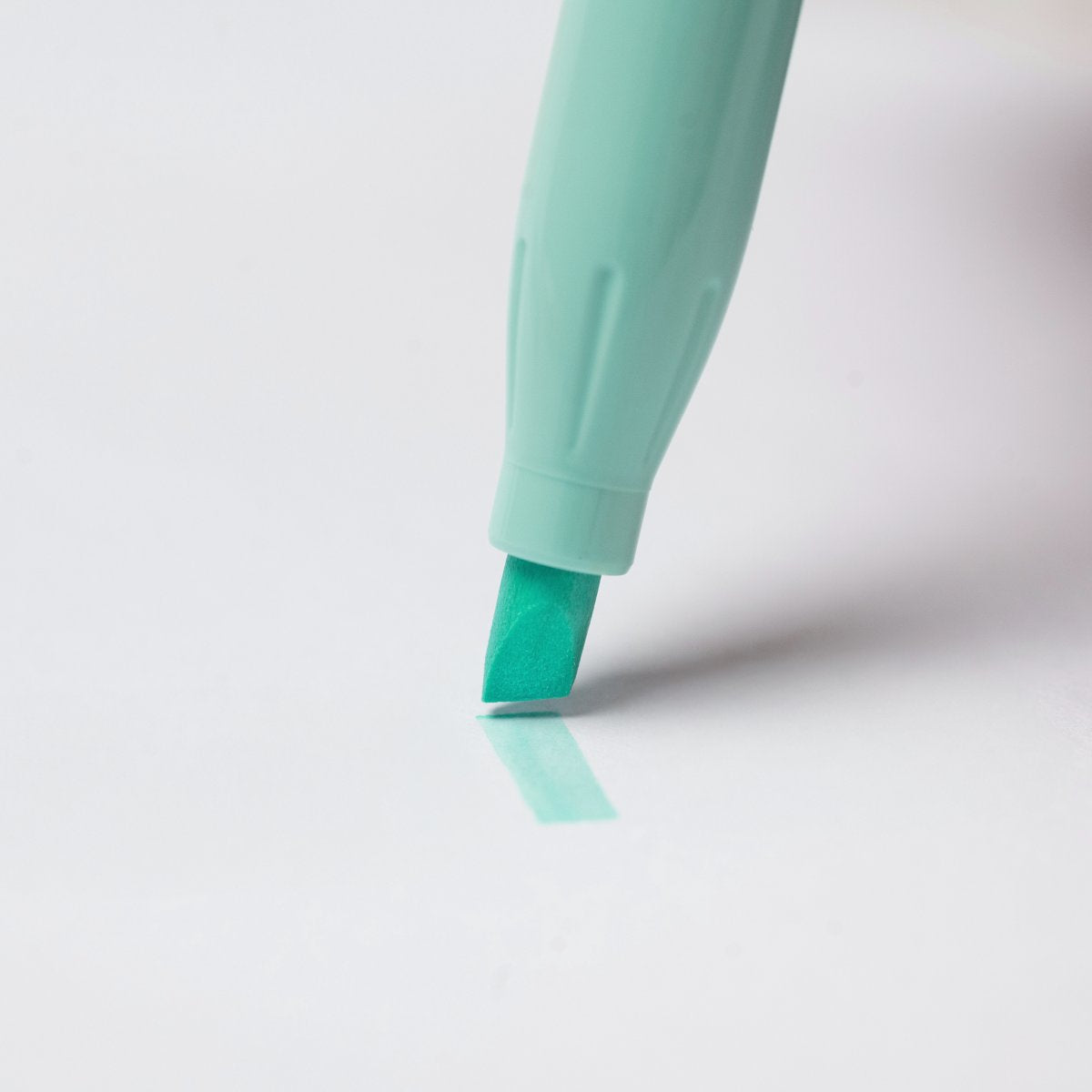 A soft green Pilot FriXion Light Soft highlighter swatch showing the pastel highlight colour drawn on white paper.