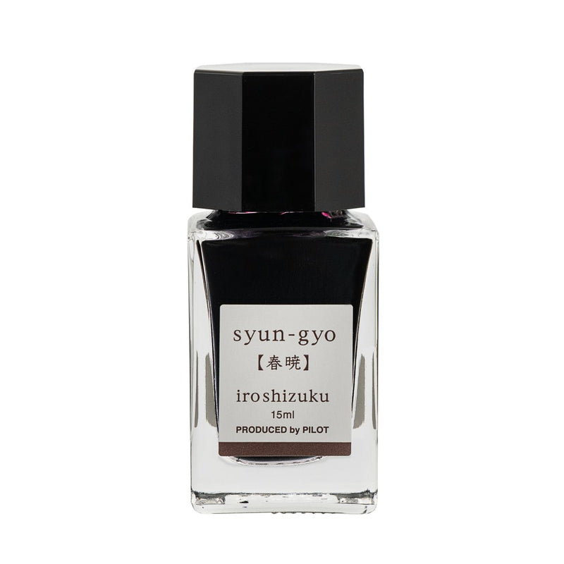 Pilot Iroshizuku 15ml bottle of Spring Dawn (Syun-gyo) fountain pen ink, a faceted clear glass bottle of bottled ink shown upright on a white background.