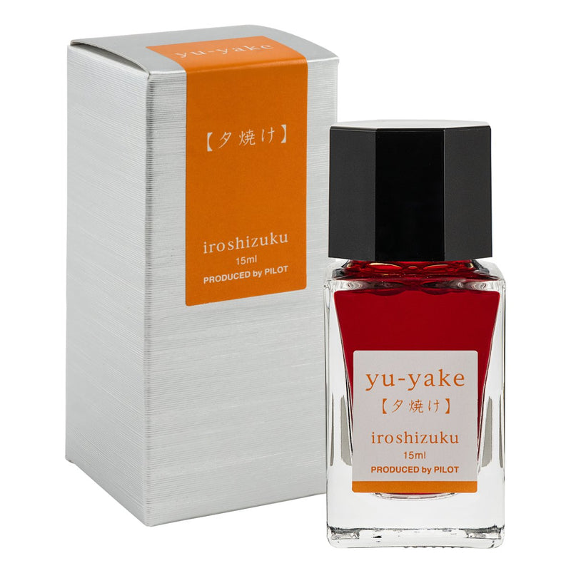 Pilot Iroshizuku 15ml Sunset Ink (Yu-yake) ink bottle shown next to its printed presentation box on a white background.