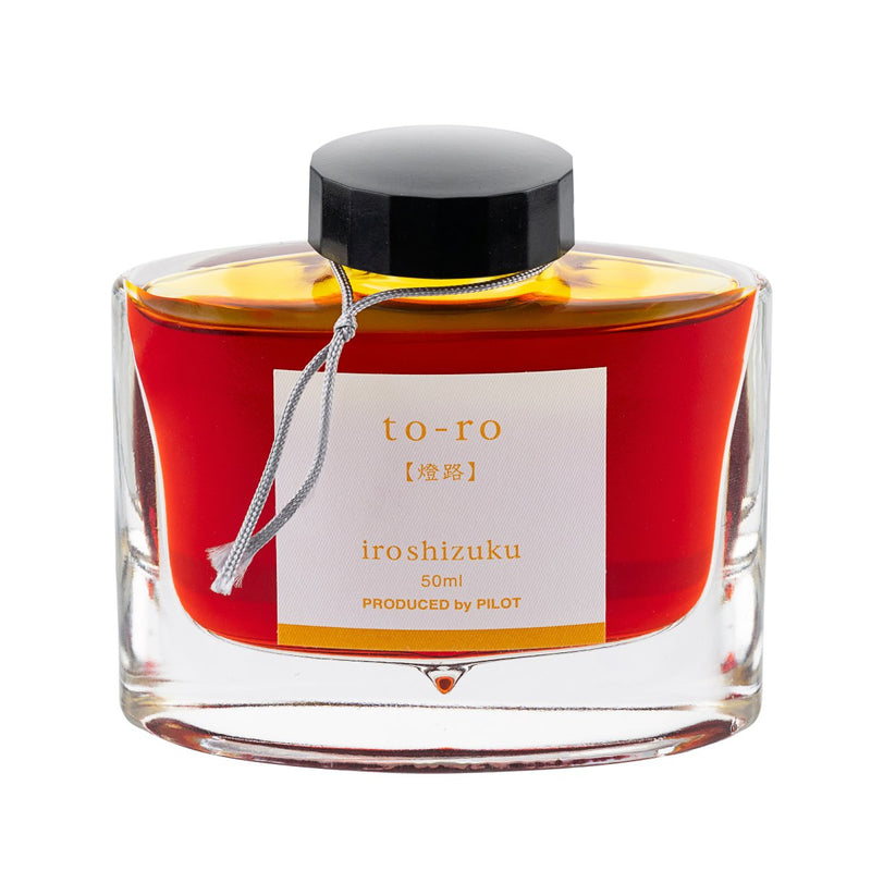 Pilot Iroshizuku 50ml bottle of Warm Lantern (To-ro) fountain pen ink, a faceted glass bottle of bottled ink shown straight on against a white background.