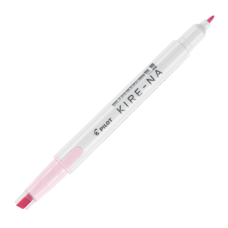 Pilot Kire-Na dual tip highlighter in pale pink, standing upright on white with both caps removed, showing the pale pink chisel tip at the base, the fine bullet tip at the top and the Kire-Na branding on the white barrel