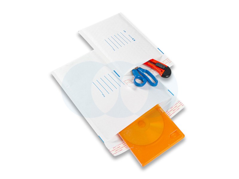 Two white Polycell Mail Tuff mailers, one holding blue scissors and a red cutter, the other with an orange CD case sliding out of the opening
