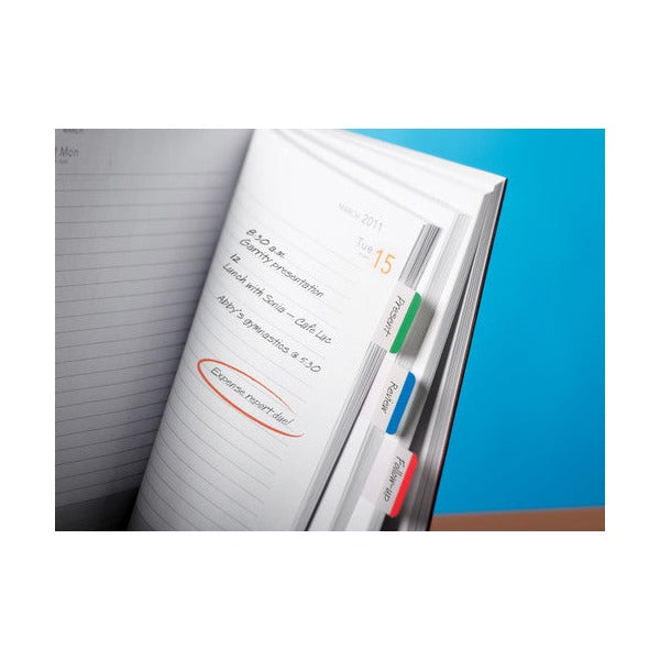 Open diary page with green, blue and red Post-it tabs labelled along the right hand edge