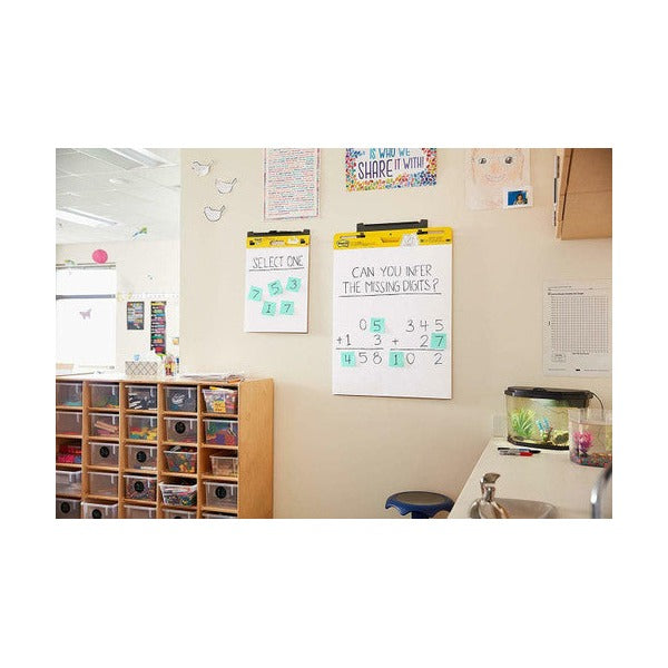 Post-it Mini Easel Pad 577SS sheet adhered to wall after presentation demonstrating self-stick clean-removal on smooth wall surface