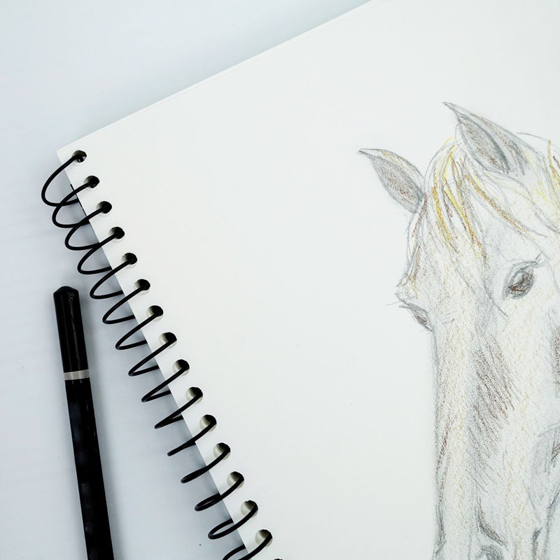 Quill Visual Art Diary A4 open at the spiral binding with a pencil horse drawing on the cartridge page and a black pen beside it