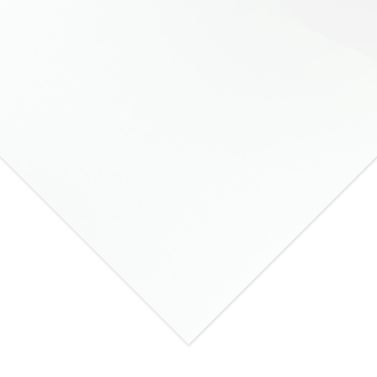 Close view of a white Quill Pasteboard A3 sheet with one corner angled towards the camera, showing the plain smooth white surface