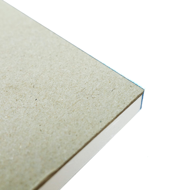 Underside corner of the Quill Sketch Pad A4 showing the grey heavyweight backing board with the white leaves above it