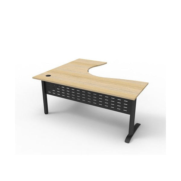 Rapidline Deluxe Rapid Span corner workstation with a Natural Oak top on Black Satin span legs and a perforated metal modesty panel, smaller angled front view.