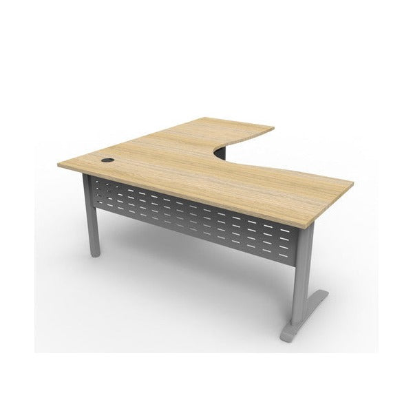 Rapidline Deluxe Rapid Span corner workstation with a Natural Oak top on Precious Silver span legs and a perforated metal modesty panel, smaller angled front view.