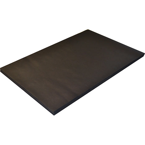 Stack of black matt paper sheets lying flat on a plain background