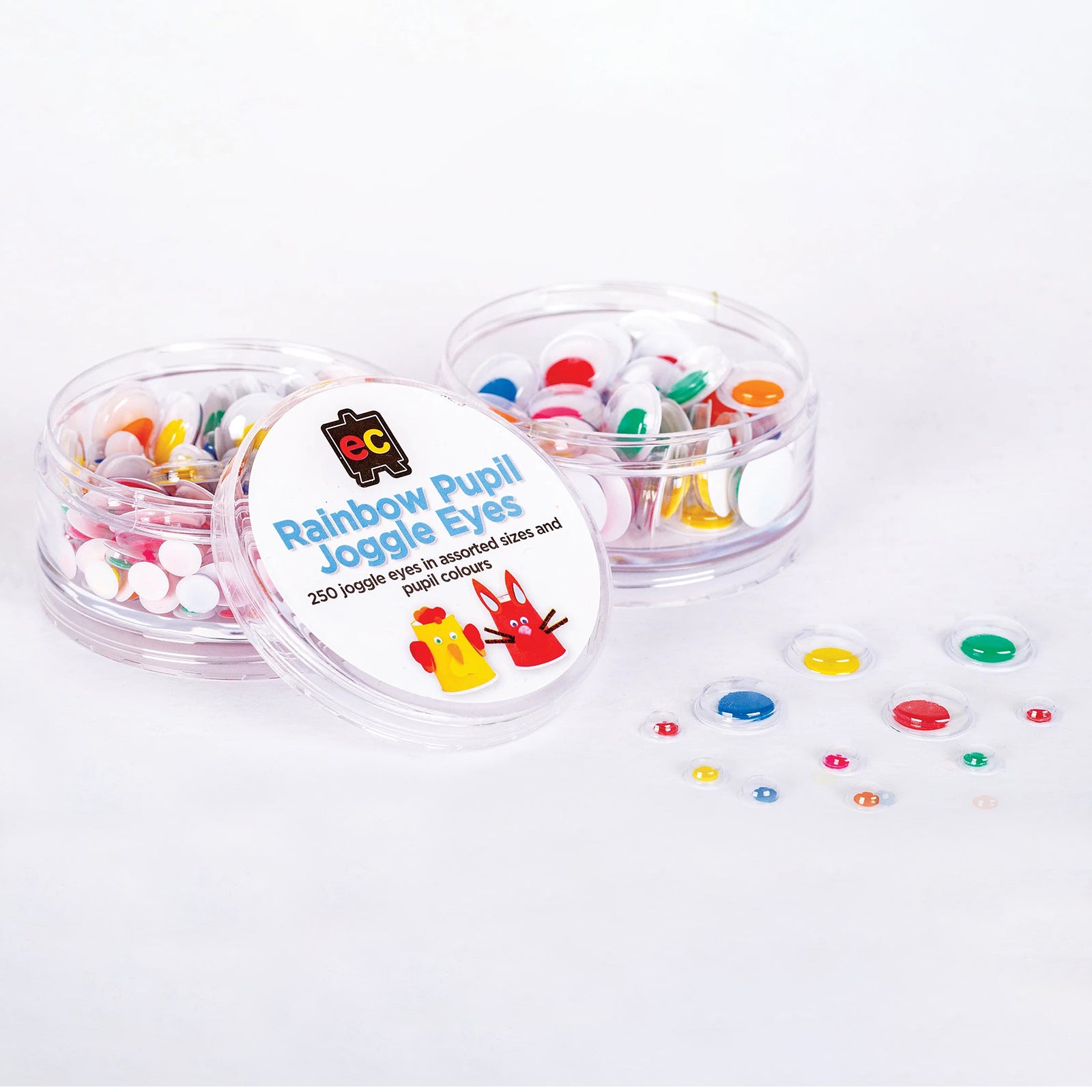 Open storage container displaying rainbow pupil joggle eyes spread alongside the product lid. The assortment of colourful pupils and multiple sizes demonstrates versatility for arts, crafts and educational activities.
