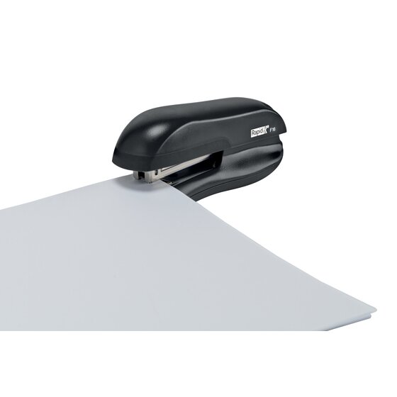 Black Rapid F16 half strip stapler fastening the corner of a white sheet of paper